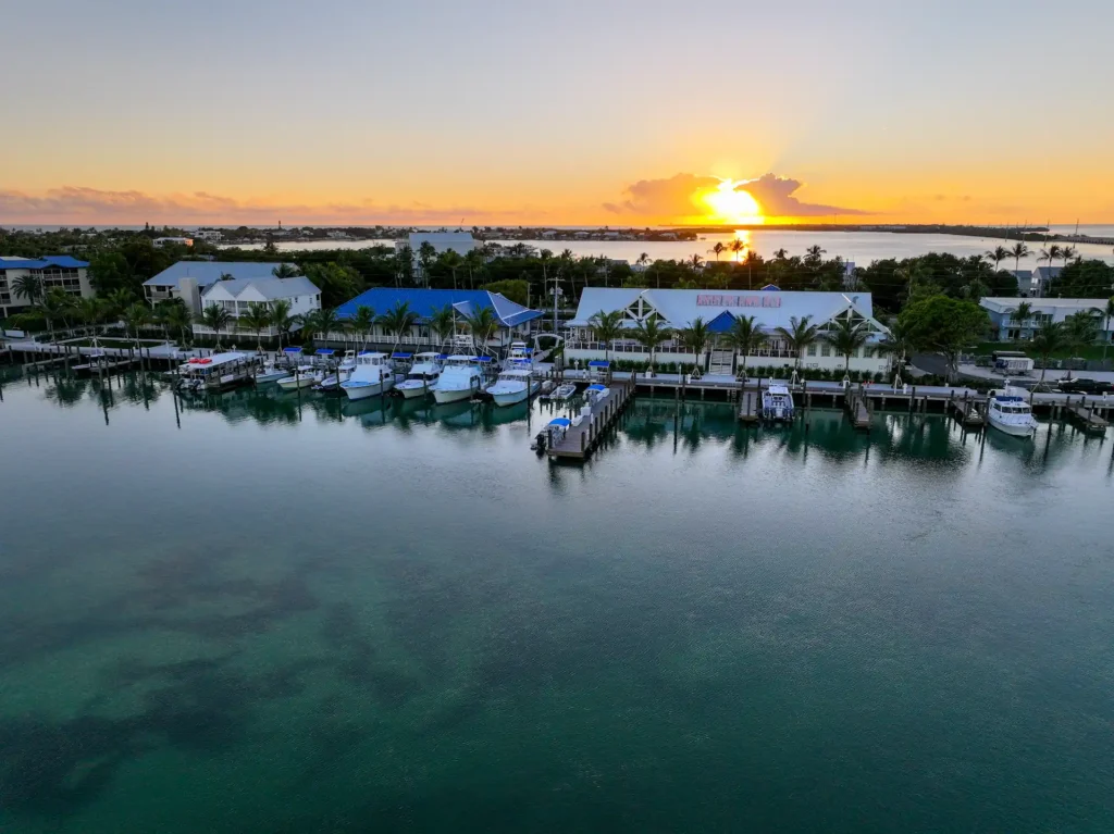 Aerial sunset view of Angler and Ale restaurant and the marina at Hawks Cay Resort.